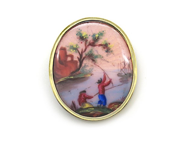 Beautiful and unique hand painted enamel brooch with
a landscape design including fishermen and beautiful
pastel coloring.